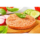 Raw minced meat patty and vegetables