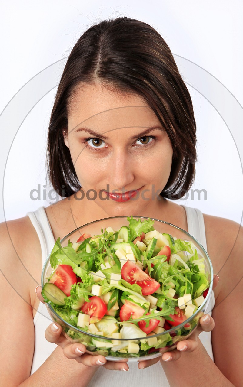 Young woman with fresh salad