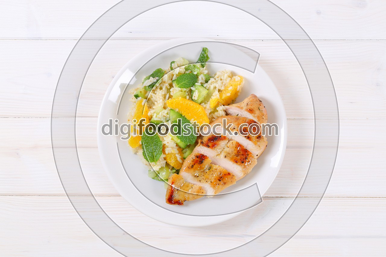 roasted chicken breast with rice and oranges