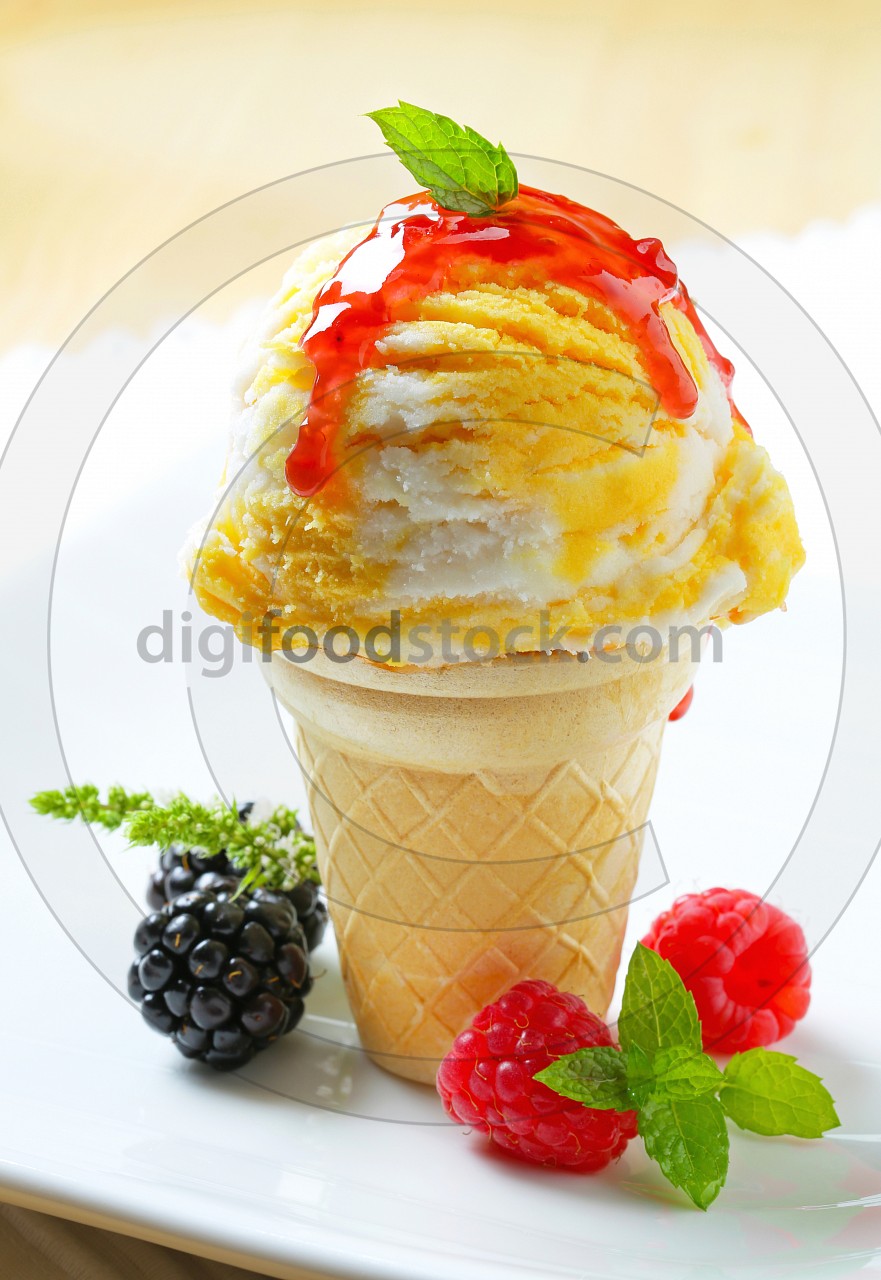 Ice cream cone with raspberry sauce